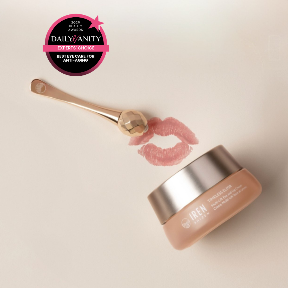 A jar of IREN Shizen TIMELESS ELIXIR Multi-Lift Eye and Lip Cream, a gold facial roller, and a pink lipstick kiss mark with a “Best Eye Care for Anti-Aging” award—ideal for targeting dark circles and signs of aging.