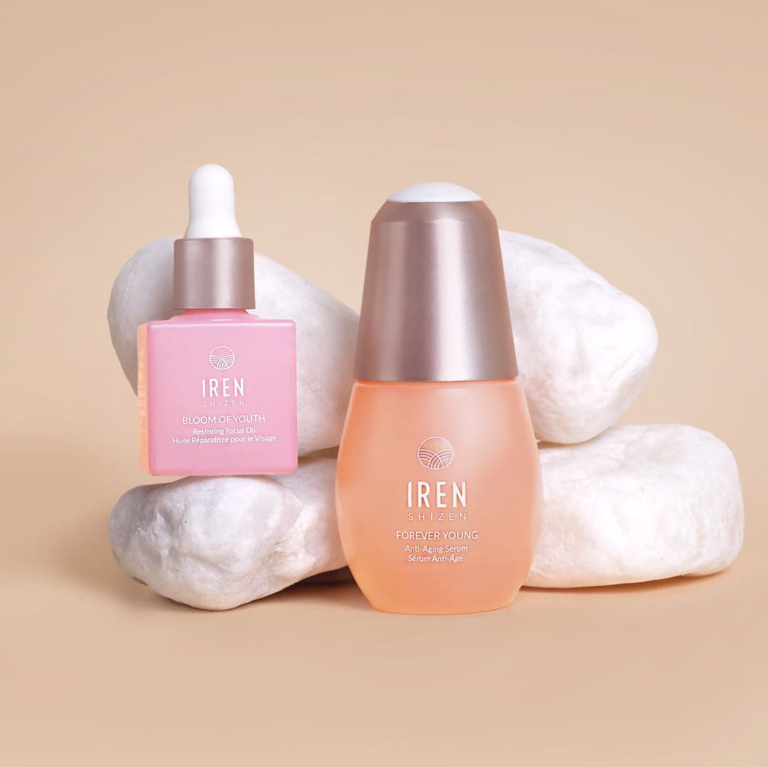 A bottle of BEST SUSTAINABLE DUO By L'OFFICIEL Beauty Awards 2023 ageless beauty serum and a bottle of BEST SUSTAINABLE DUO By L'OFFICIEL Beauty Awards 2023 restoring facial oil by IREN Shizen.