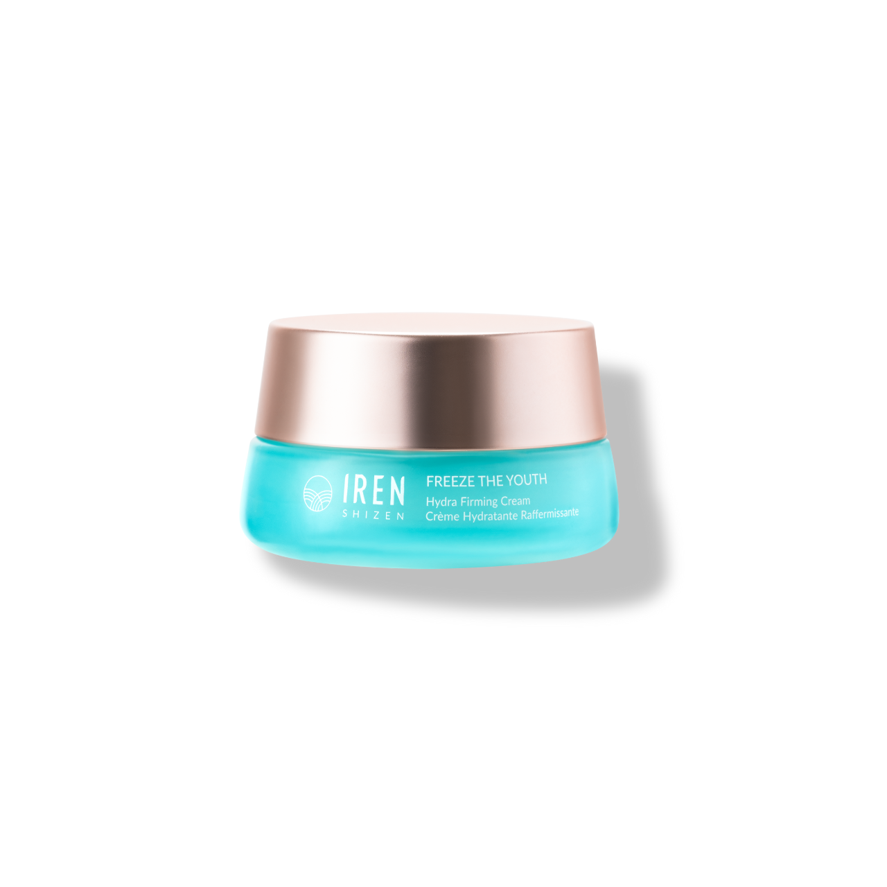 A turquoise jar of FREEZE THE YOUTH Hydra Firming Cream by IREN Shizen with a metallic lid showcases its age-defying snow mushroom extract formula, isolated on a white background.