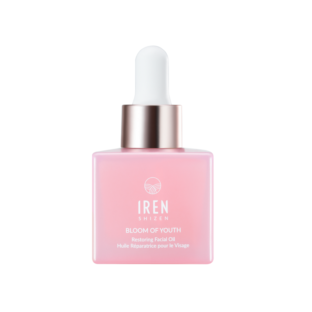 A bottle of IREN Shizen's SAMPLE Facial Oils featuring customized Japanese skincare on a black background.