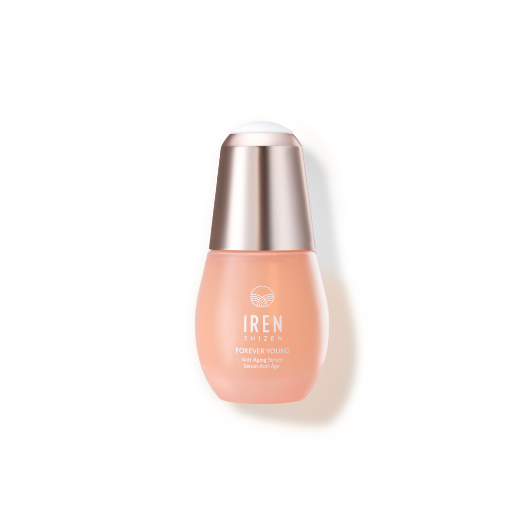 A bottle of Fast Bundle's "Mix & Match" serum with a peach hue and a metallic cap against a white background.