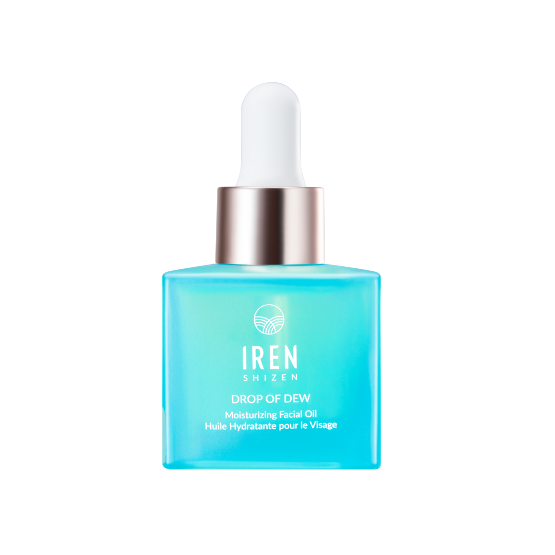 A bottle of custom IREN Shizen SAMPLE Facial Oils on a black background.